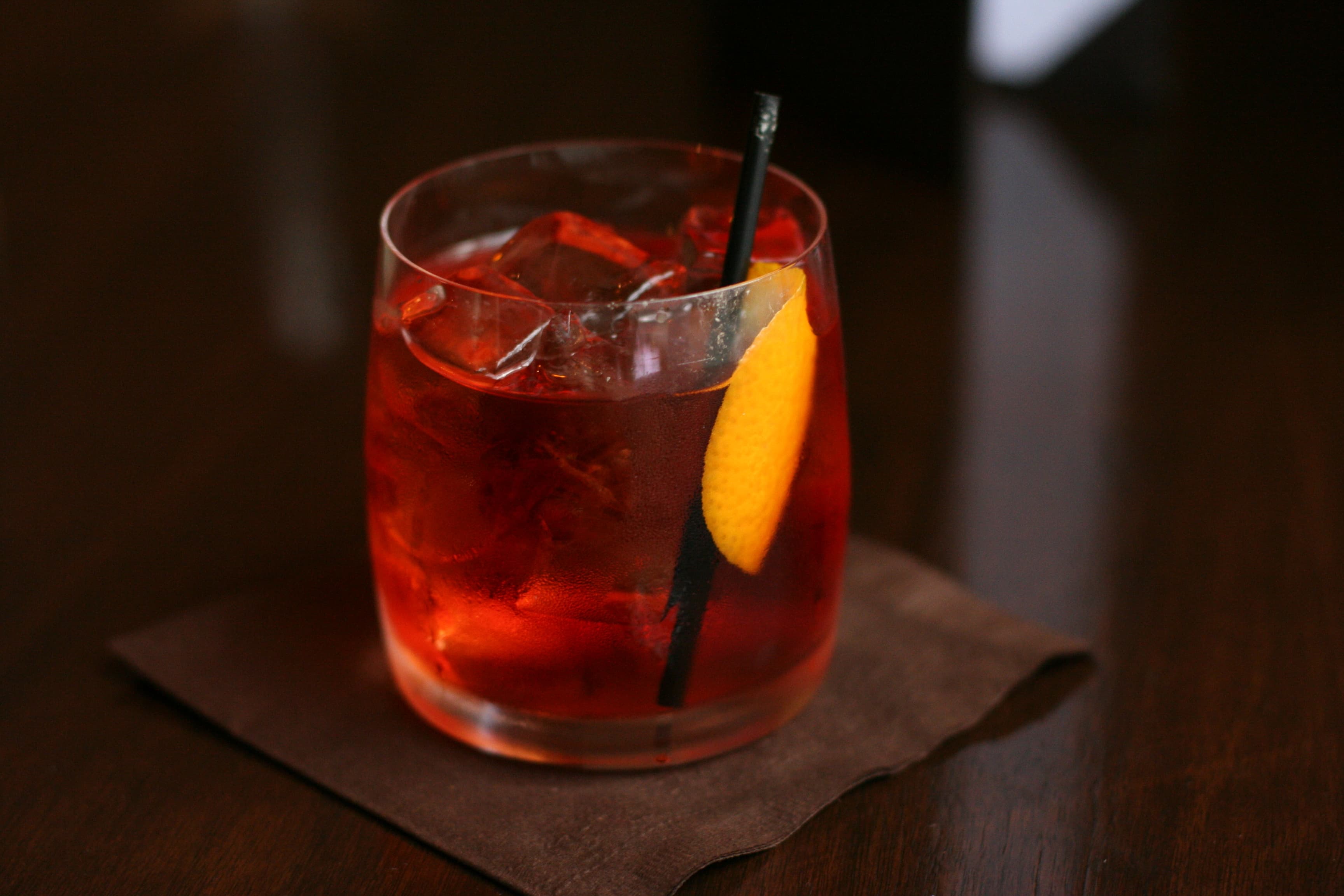 Negroni cocktail with orange peel garnish